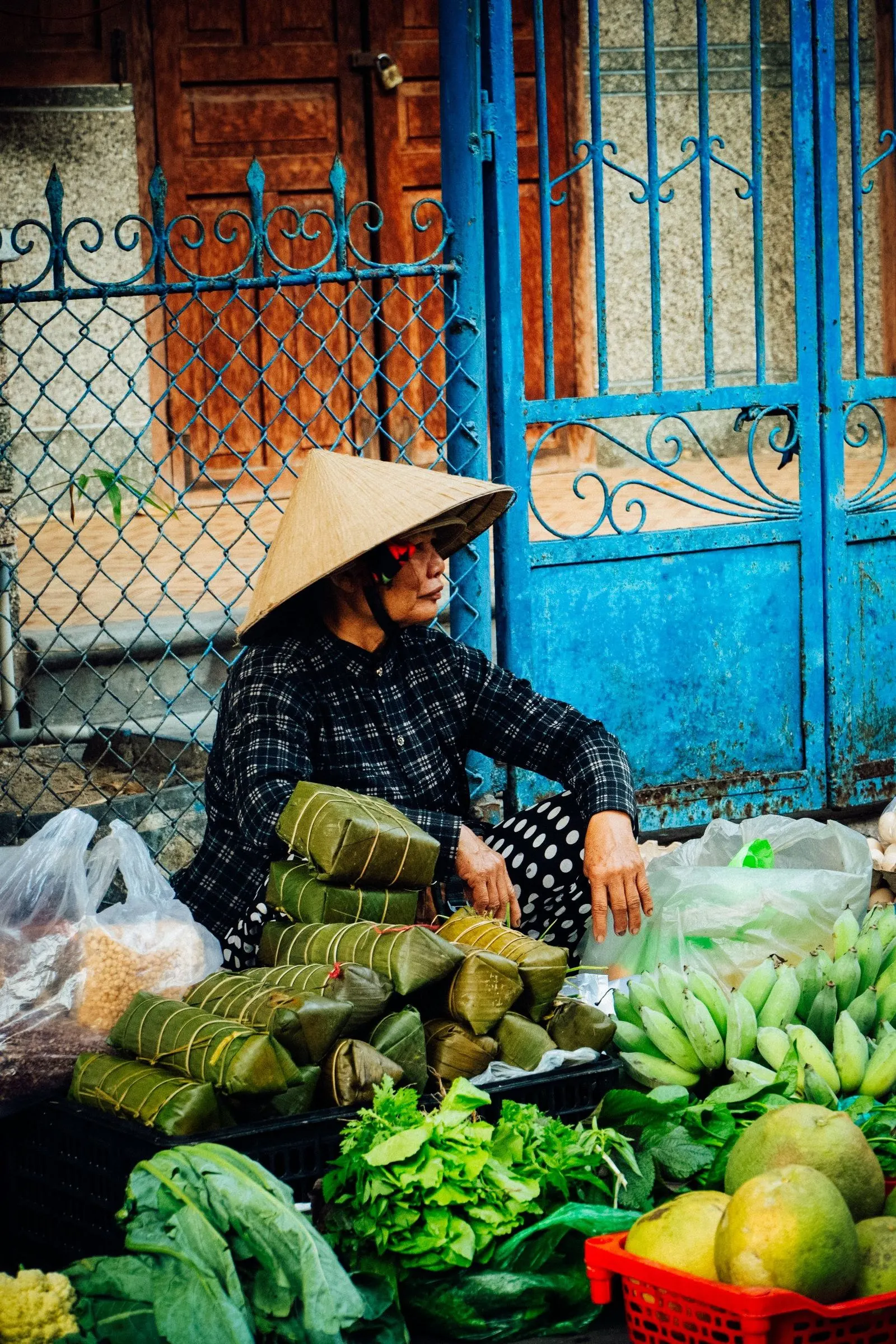 A vendor at a fresh-produce market